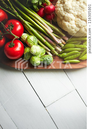 Home, desk and veg on cutting board for cooking with diet, nutrition and healthy living. Fresh, food and kitchen counter with organic or vegetarian meal for wellness, wellbeing and self care on table Home, desk and veg on cutting board for cooking with diet, nutrition and healthy living. Fresh, food and kitchen counter with organic or vegetarian meal for wellness, wellbeing and self care on table 116305801