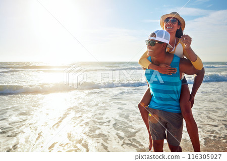 Black couple, beach and piggyback for holiday, vacation and bonding with romance, fun and adventure. Happy young people walking with sunglasses in Miami for support, travel and love in lens flare 116305927