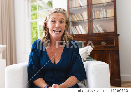 Caucasian senior female having video call at home with surprised look Caucasian senior female having video call at home with surprised look 116306700