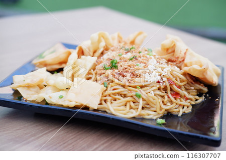 Spicy fried noodles with wonton crackers Spicy fried noodles with wonton crackers 116307707