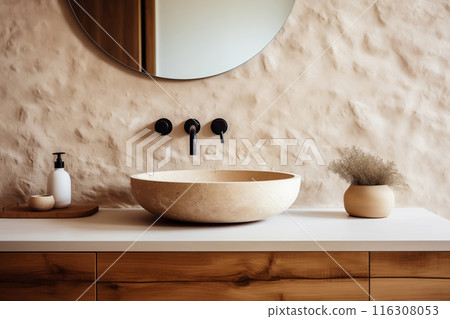 Stone vessel sink with mirror against textured stone wall in minimal bathroom in natural earth tones Stone vessel sink with mirror against textured stone wall in minimal bathroom in natural earth tones 116308053