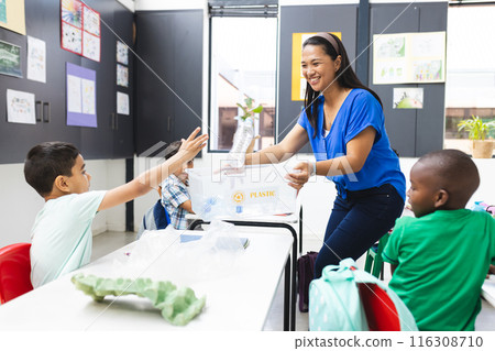 A diverse classroom learns about recycling A diverse classroom learns about recycling 116308710
