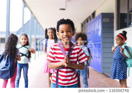 In school, group of young students are standing in hallway outdoors In school, group of young students are standing in hallway outdoors 116308748