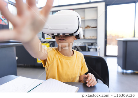 Biracial boy explores virtual reality at school 116309126