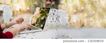 Banner Woman typing laptop computer online meeting at home office work from home. Asian businesswoman use notebook laptop. Programmer woman typing keyboard laptop read online website with copy space 116309659