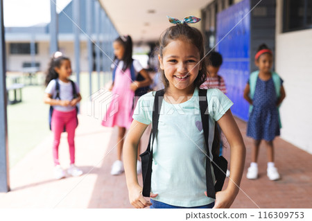 Students with backpacks standing together, smiling and ready for school 116309753