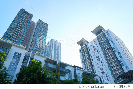 Modern apartment buildings reaching for the sky in the city Modern apartment buildings reaching for the sky in the city 116309899