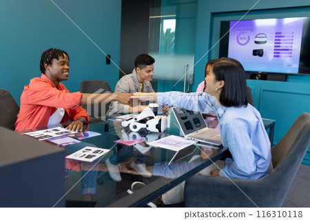 Business team discuss VR, startup, teamwork, and collaboration while shaking hands Business team discuss VR, startup, teamwork, and collaboration while shaking hands 116310118