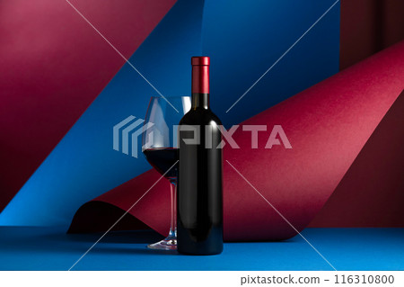 Bottle and glass of red wine. Bottle and glass of red wine. 116310800