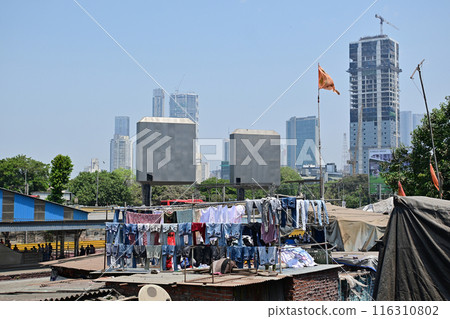 Dhobi Ghat, is an open air laundry place in near by Mahalaxmi railway station in Mumbai, India Dhobi Ghat, is an open air laundry place in near by Mahalaxmi railway station in Mumbai, India 116310802