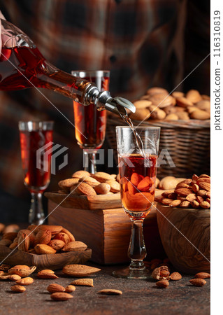 Italian liqueur Amaretto with almonds nuts. Italian liqueur Amaretto with almonds nuts. 116310819