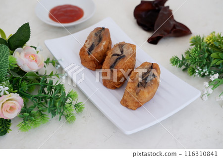 Spicy fried tofu filled with meat 116310841