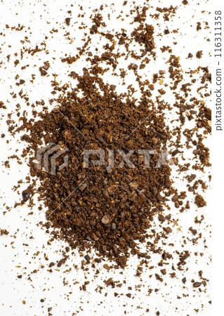 Pile of freshly ground coffee beans on a white background Pile of freshly ground coffee beans on a white background 116311358