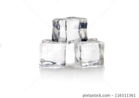 Three ice cubes balancing on top of each other creating a small tower 116311361