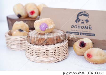 flavored ball donuts as a background flavored ball donuts as a background 116311438