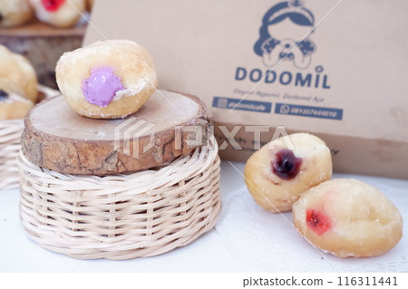 flavored ball donuts as a background flavored ball donuts as a background 116311441