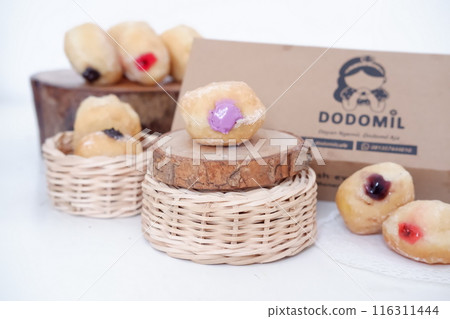 flavored ball donuts as a background flavored ball donuts as a background 116311444