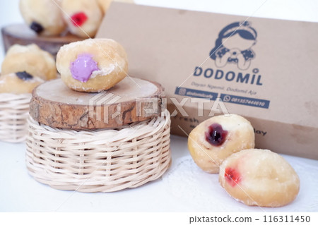 flavored ball donuts as a background flavored ball donuts as a background 116311450