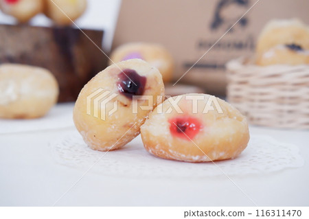 flavored ball donuts as a background flavored ball donuts as a background 116311470