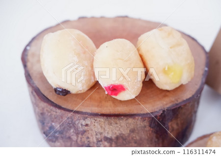 flavored ball donuts as a background flavored ball donuts as a background 116311474