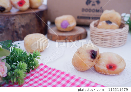 flavored ball donuts as a background flavored ball donuts as a background 116311479