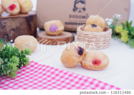 flavored ball donuts as a background flavored ball donuts as a background 116311480