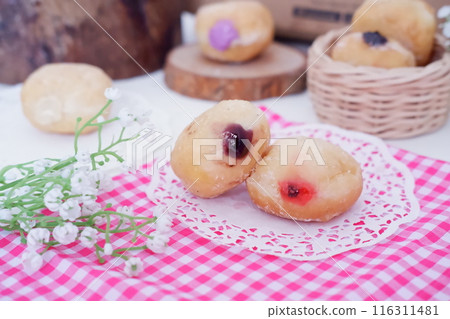 flavored ball donuts as a background flavored ball donuts as a background 116311481