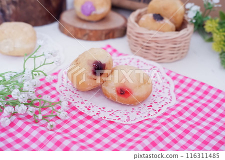 flavored ball donuts as a background flavored ball donuts as a background 116311485