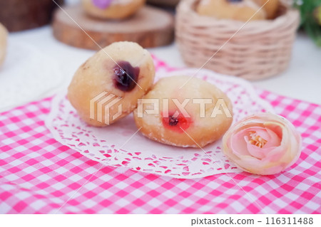flavored ball donuts as a background flavored ball donuts as a background 116311488