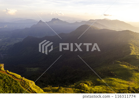Landscape of Morning Mist with Mountain Layer at north of Thailand. mountain ridge and clouds in rural jungle bush forest Landscape of Morning Mist with Mountain Layer at north of Thailand. mountain ridge and clouds in rural jungle bush forest 116311774