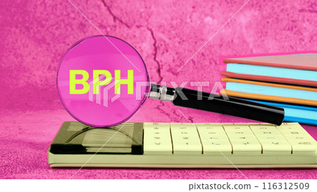 BPH Benign Prostatic Hyperplasia. BPH written through a magnifying glass standing on a calculator in bright colors BPH Benign Prostatic Hyperplasia. BPH written through a magnifying glass standing on a calculator in bright colors 116312509