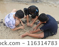Photo of 3 children playing on the beach 116314783
