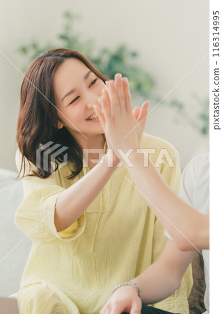 High five couple husband and wife 116314995