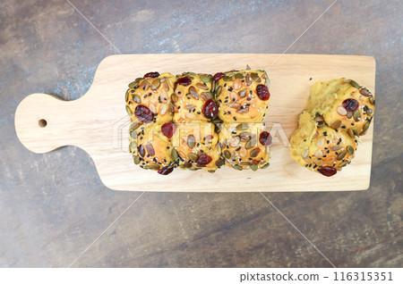 pumpkin bread or loaf of bread or bread with pumpkin seed, cranberry and sesame topping pumpkin bread or loaf of bread or bread with pumpkin seed, cranberry and sesame topping 116315351