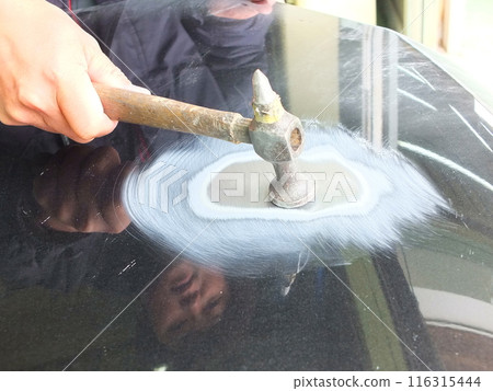 Putty filling and finishing work at an automobile body repair and painting factory 01 Putty filling and finishing work at an automobile body repair and painting factory 01 116315444
