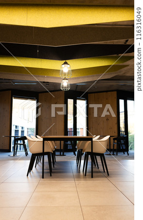 Modern office space with empty chairs and tables, ready for business meetings, copy space Modern office space with empty chairs and tables, ready for business meetings, copy space 116316049