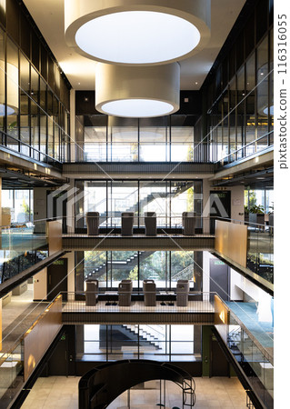 Showcasing architecture, modern office building interior with glass walls and open staircases, copy Showcasing architecture, modern office building interior with glass walls and open staircases, copy 116316055