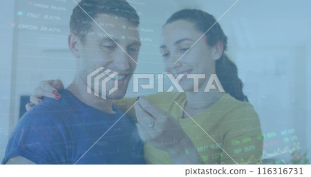Image of graphs, trading board over caucasian woman holding key and kissing man at home Image of graphs, trading board over caucasian woman holding key and kissing man at home 116316731