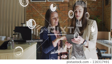 Image of statistical data processing over two caucasian women discussing over digital tablet Image of statistical data processing over two caucasian women discussing over digital tablet 116317491
