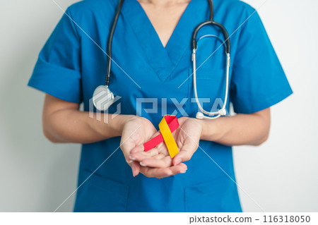 World hepatitis day awareness month, 28 July. Doctor holding Red and Yellow ribbon. Liver cancer, Jaundice, Cirrhosis, Failure, Enlarged, Hepatic Encephalopathy and Health concept World hepatitis day awareness month, 28 July. Doctor holding Red and Yellow ribbon. Liver cancer, Jaundice, Cirrhosis, Failure, Enlarged, Hepatic Encephalopathy and Health concept 116318050