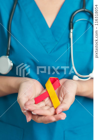 World hepatitis day awareness month, 28 July. Doctor holding Red and Yellow ribbon. Liver cancer, Jaundice, Cirrhosis, Failure, Enlarged, Hepatic Encephalopathy and Health concept 116318054
