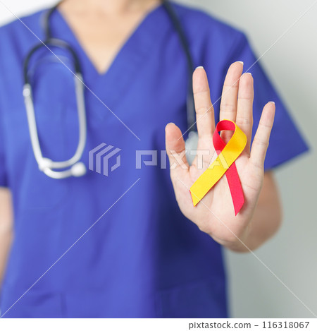 World hepatitis day awareness month, 28 July. Doctor holding Red and Yellow ribbon. Liver cancer, Jaundice, Cirrhosis, Failure, Enlarged, Hepatic Encephalopathy and Health concept 116318067