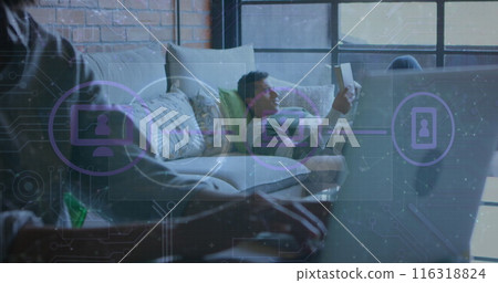 Image of connected icons, connected dots over midsection of african american man using laptop 116318824