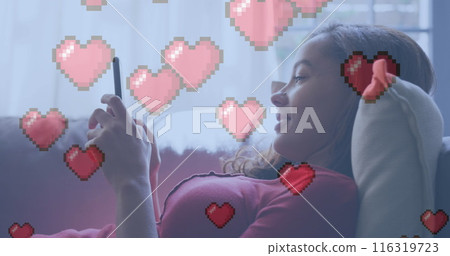 Image of heart digital icons over woman using smartphone at home Image of heart digital icons over woman using smartphone at home 116319723