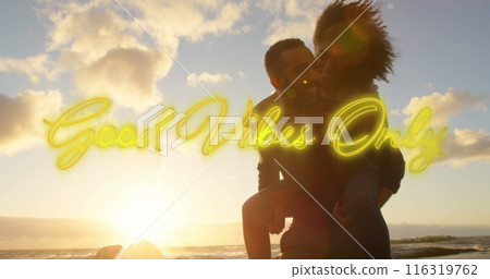 Image of text vibes over people by seaside 116319762