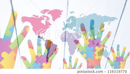 Image of hands with colourful puzzle pieces and world map 116319778
