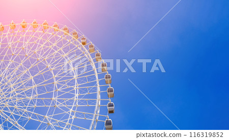 white ferris wheel on background clear blue sky in Navruz Park in Tashkent with copy space 116319852