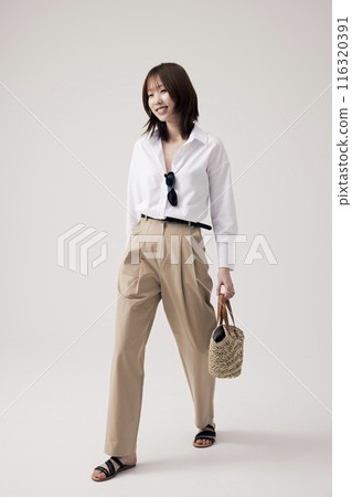 Korean Woman Poses Walking With Bags Korean Woman Poses Walking With Bags 116320391