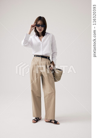 Korean Woman Poses to Wear Sunglasses 116320393