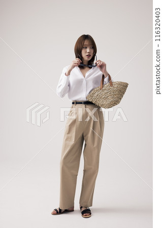 a Korean woman wearing sunglasses a Korean woman wearing sunglasses 116320403